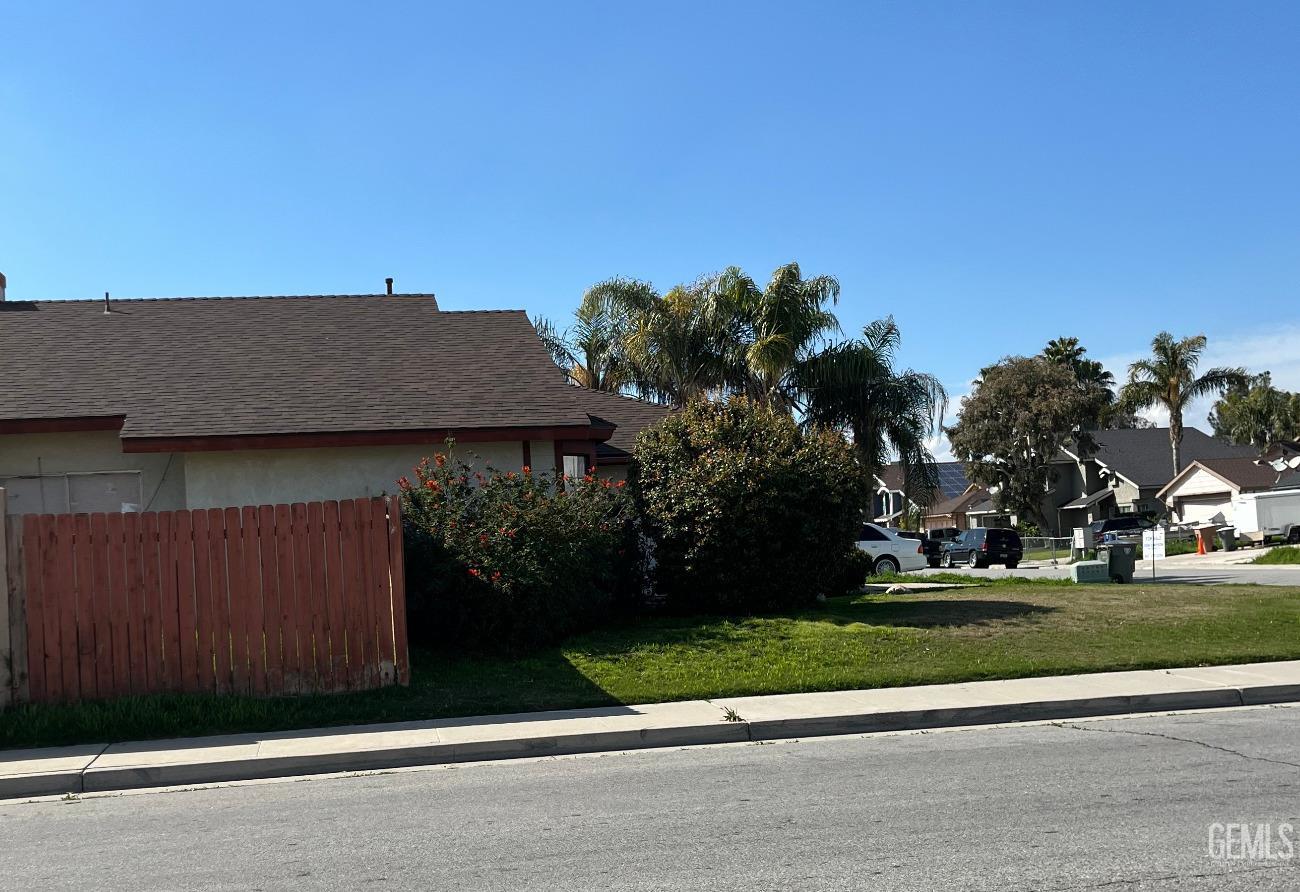 Undisclosed Address Bakersfield, CA 93304 - Photo 3 of 21 a backyard of a house with lots of green space