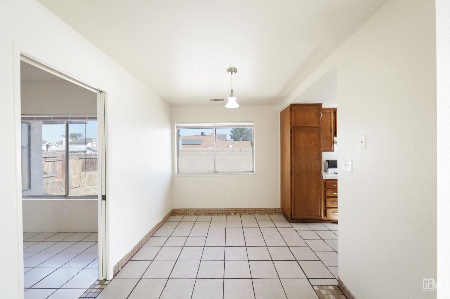 Undisclosed Address Bakersfield, CA 93304 - Photo 7 of 21 an empty room with windows and closet