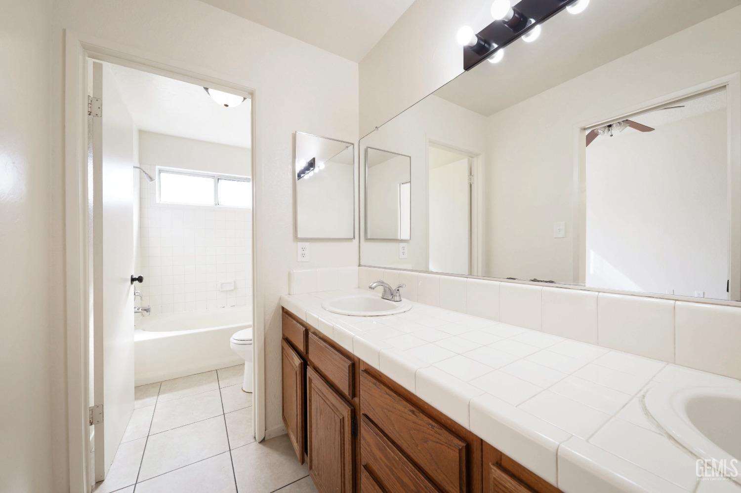 Undisclosed Address Bakersfield, CA 93304 - Photo 9 of 21 a bathroom with a sink and a bathtub