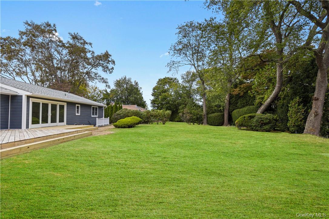 5 Paddock Road Rye Brook, NY 10573 - Photo 20 of 23 View of yard featuring a deck, plenty of yard space