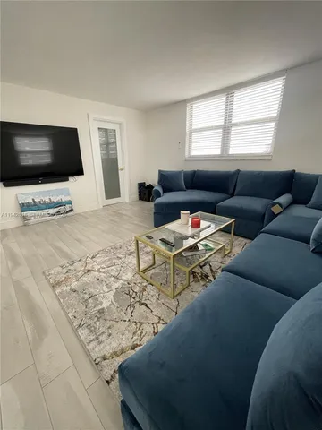 a living room with a flat screen tv