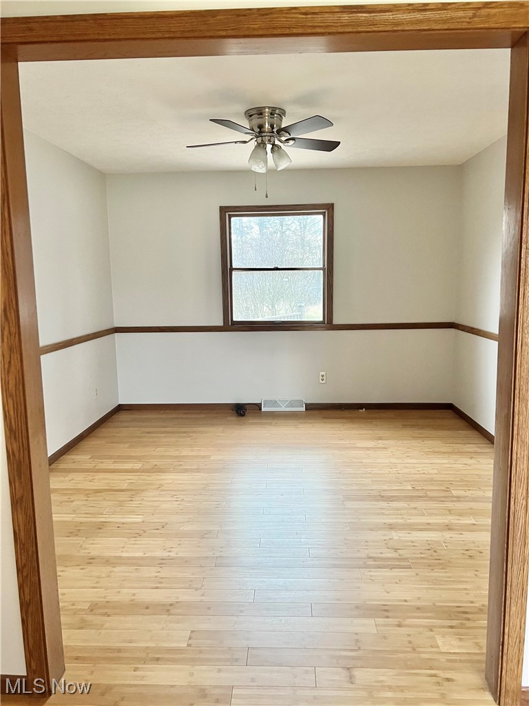 15317 Strader Road East Liverpool, OH 43920 - Photo 12 of 23 Unfurnished room featuring light hardwood / wood-style floors and ceiling fan