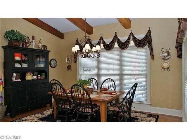 5617 Foxbury Drive Oak Ridge, NC 27310 - Photo 5 of 15 Breakfast. Breakfast Area with Vaulted Ceiling w/ Cedar Beams & Transom Windows