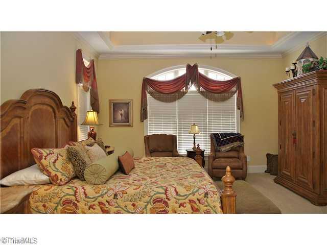 5617 Foxbury Drive Oak Ridge, NC 27310 - Photo 7 of 15 Master Bedroom. Main Level Master Suite W/Uplighted Tray Ceiling & Sitting Area