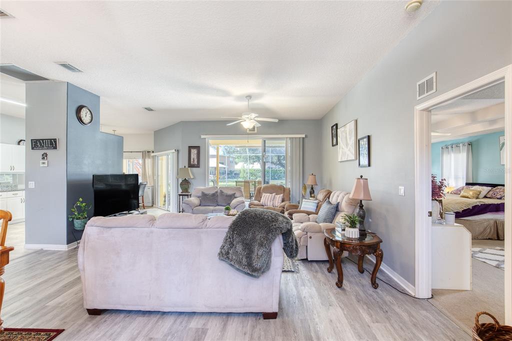 4 Cliffside Drive Ormond Beach, FL 32174 - Photo 11 of 65 a living room with fireplace furniture and a wooden floor
