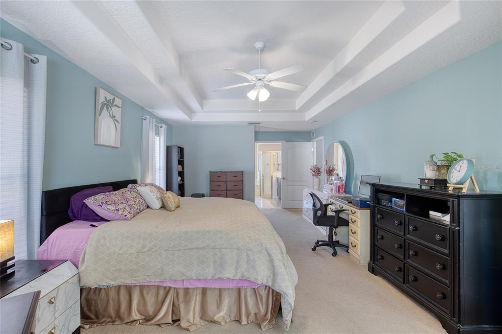 4 Cliffside Drive Ormond Beach, FL 32174 - Photo 15 of 65 a bedroom with a bed and wooden floor
