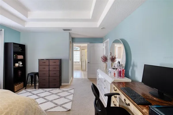 a view of a livingroom with furniture and a chandelier