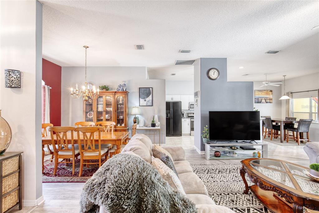 4 Cliffside Drive Ormond Beach, FL 32174 - Photo 22 of 65 a living room with furniture and a flat screen tv