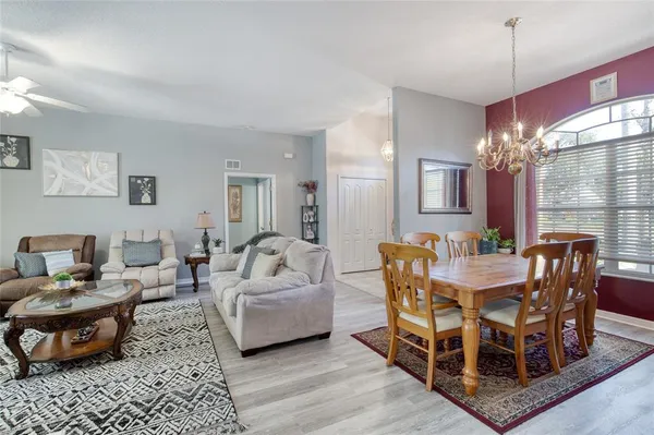 a kitchen with stainless steel appliances kitchen island granite countertop a stove sink and cabinets