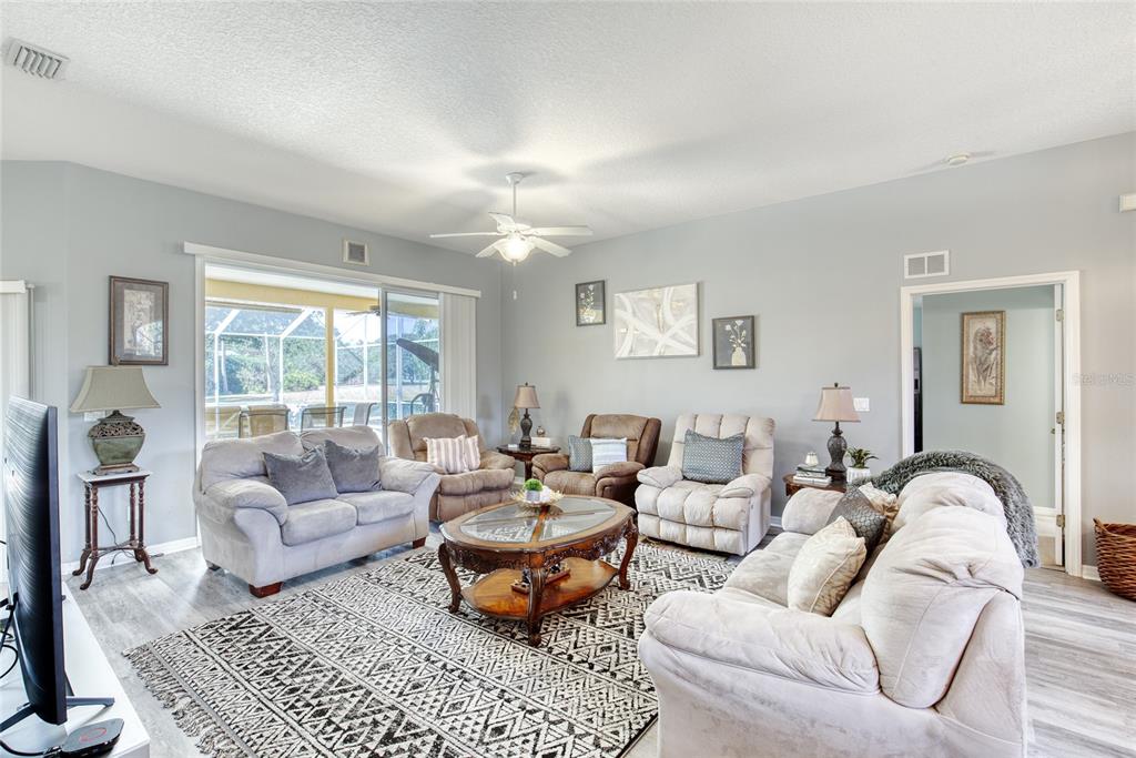 4 Cliffside Drive Ormond Beach, FL 32174 - Photo 25 of 65 a living room with furniture and a large window