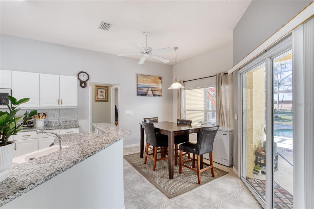 4 Cliffside Drive Ormond Beach, FL 32174 - Photo 28 of 65 a view of a dining room with furniture window and outside view