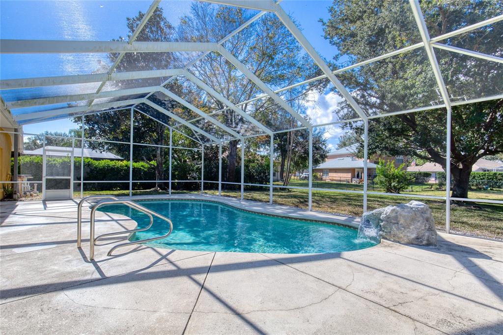 4 Cliffside Drive Ormond Beach, FL 32174 - Photo 3 of 65 a view of a swimming pool with a patio