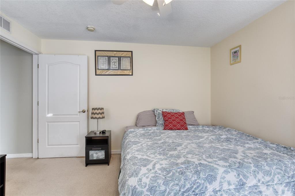 4 Cliffside Drive Ormond Beach, FL 32174 - Photo 38 of 65 a bedroom with a bed and a table