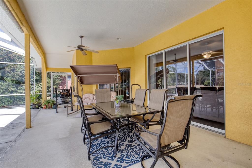 4 Cliffside Drive Ormond Beach, FL 32174 - Photo 40 of 65 a dining room with furniture and a floor to ceiling window