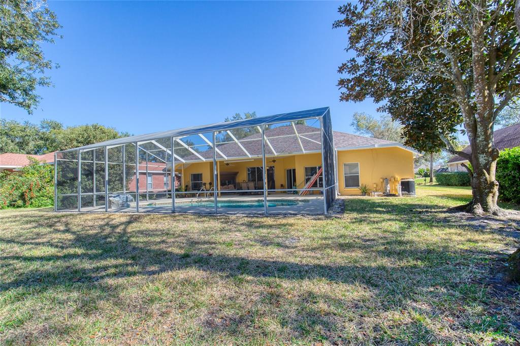 4 Cliffside Drive Ormond Beach, FL 32174 - Photo 46 of 65 a view of a house with backyard and sitting area