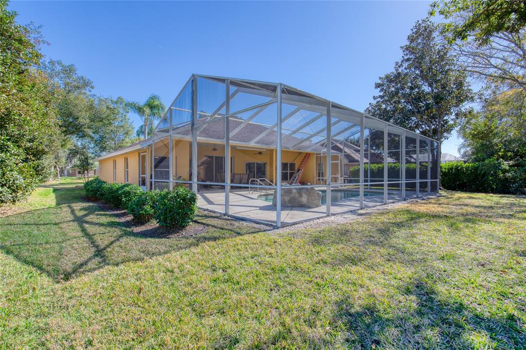 4 Cliffside Drive Ormond Beach, FL 32174 - Photo 48 of 65 a view of a house with backyard and sitting area
