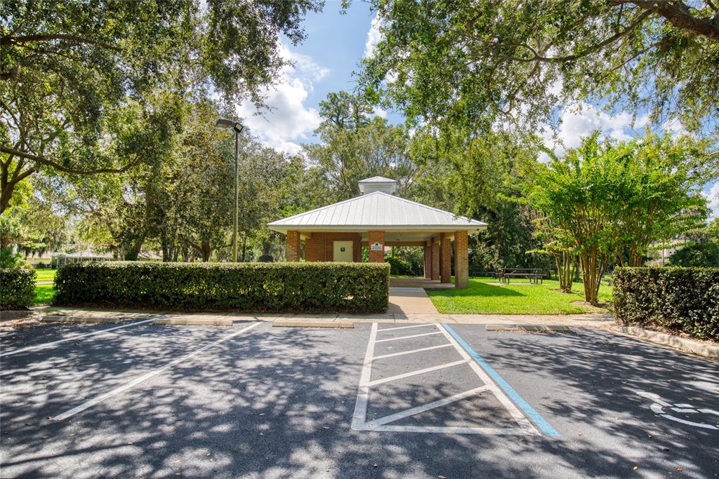 4 Cliffside Drive Ormond Beach, FL 32174 - Photo 62 of 65 a view of a patio with a table and chairs under an umbrella