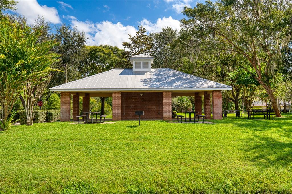 4 Cliffside Drive Ormond Beach, FL 32174 - Photo 63 of 65 a view of a house with a yard and sitting area