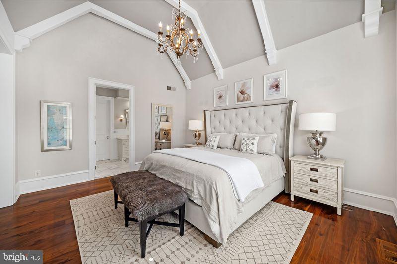 200 Parsons Road Landenberg, PA 19350 - Photo 22 of 55 a spacious bedroom with a bed a chandelier and a dresser