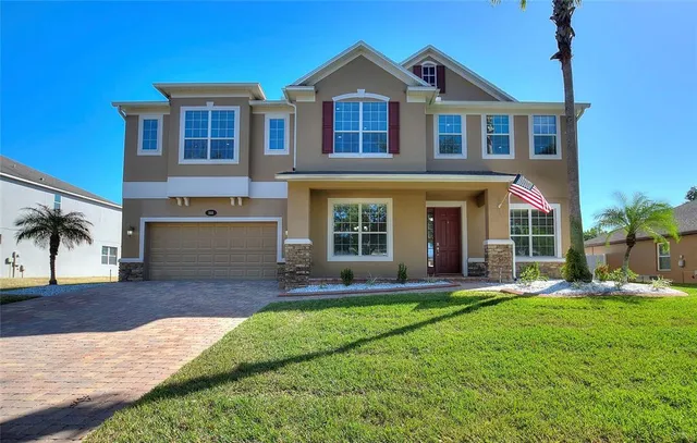 a view of a house with a yard