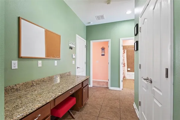 a bathroom with a double vanity sink toilet mirror and bathtub