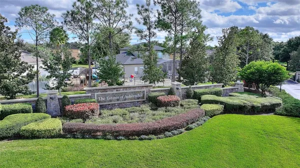 a view of a backyard with swimming pool