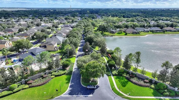 a view of a backyard with table and chairs
