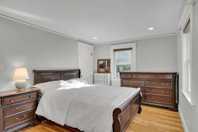 a bedroom with a bed and a dresser