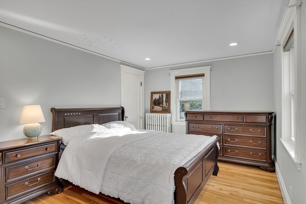 33 Avon Road Wellesley, MA 02482 - Photo 26 of 35 a bedroom with a bed and a dresser