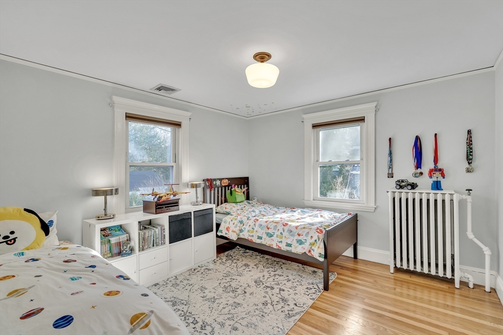 33 Avon Road Wellesley, MA 02482 - Photo 27 of 35 a bedroom with a bed and a window