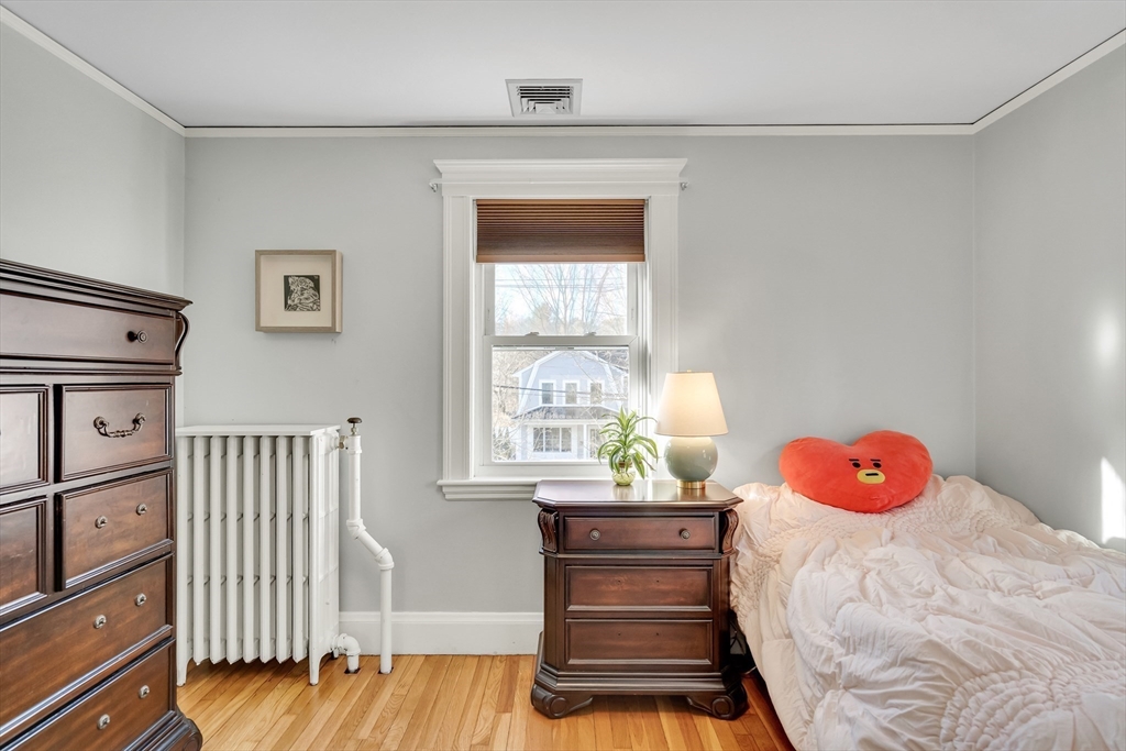 33 Avon Road Wellesley, MA 02482 - Photo 29 of 35 a bedroom with a bed and a window