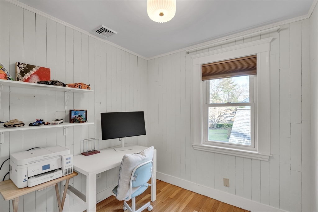 33 Avon Road Wellesley, MA 02482 - Photo 30 of 35 a living room with furniture and a flat screen tv