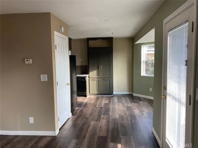 a kitchen with a sink appliances and cabinets