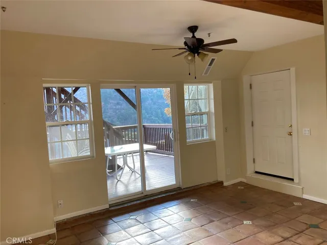 a view of balcony with wooden floor and outdoor seating