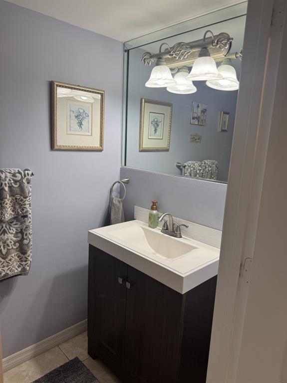 12353 Natalies Cove Road Cooper City, FL 33330 - Photo 13 of 24 a bathroom with a sink vanity and mirror