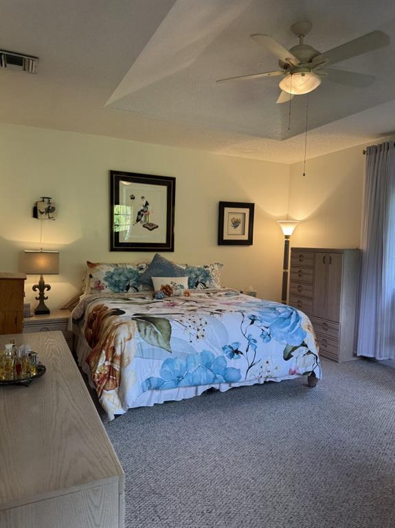 12353 Natalies Cove Road Cooper City, FL 33330 - Photo 14 of 24 a bedroom with a bed and a chandelier