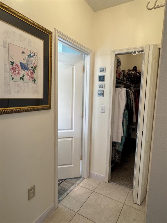 12353 Natalies Cove Road Cooper City, FL 33330 - Photo 17 of 24 a view of a hallway to rooms