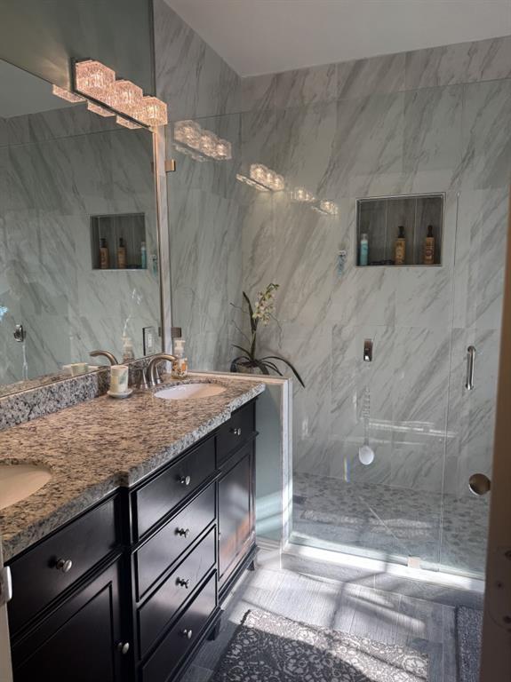 12353 Natalies Cove Road Cooper City, FL 33330 - Photo 18 of 24 a bathroom with a granite countertop sink a mirror and shower