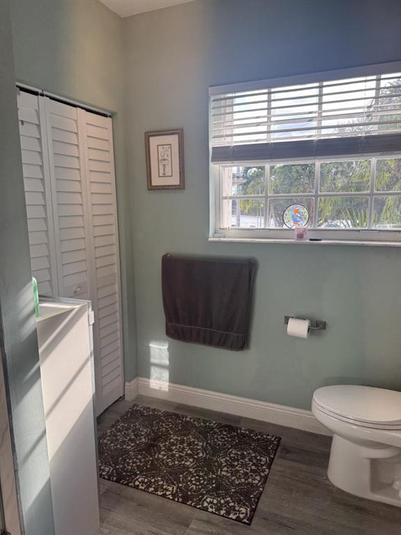 12353 Natalies Cove Road Cooper City, FL 33330 - Photo 19 of 24 a bathroom with a toilet a sink and a window