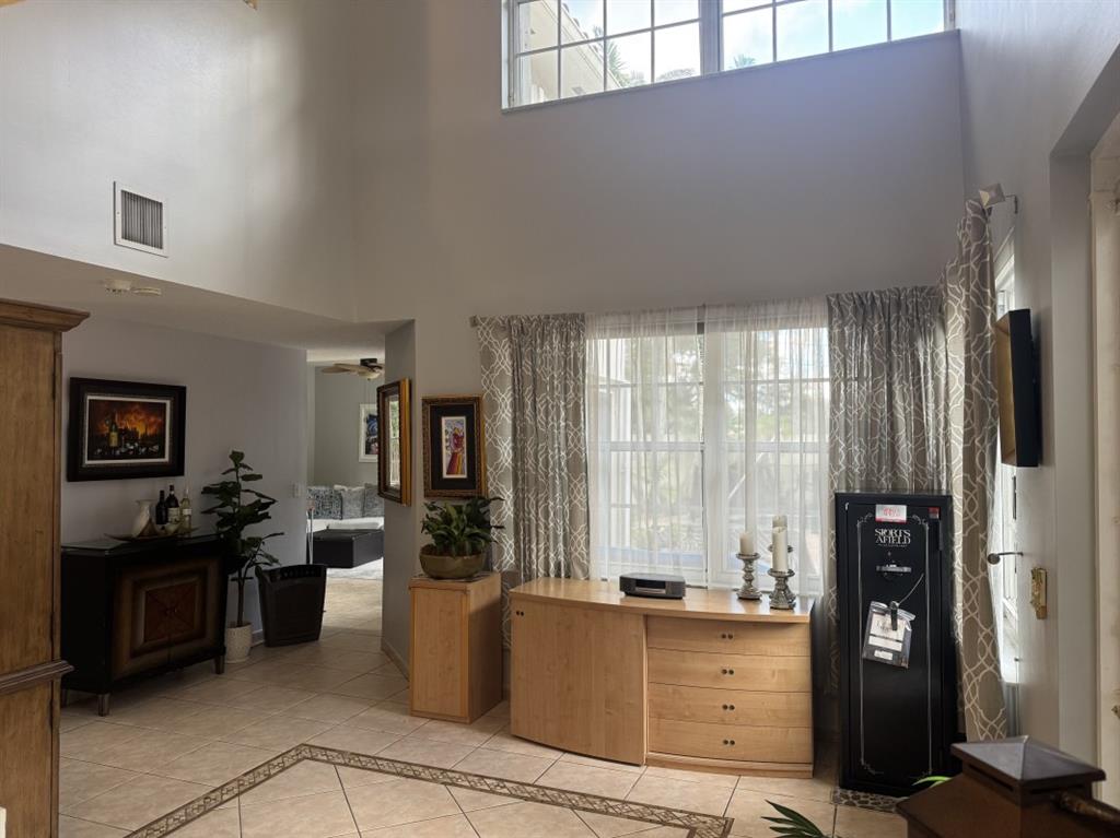 12353 Natalies Cove Road Cooper City, FL 33330 - Photo 4 of 24 a living room with furniture and large windows