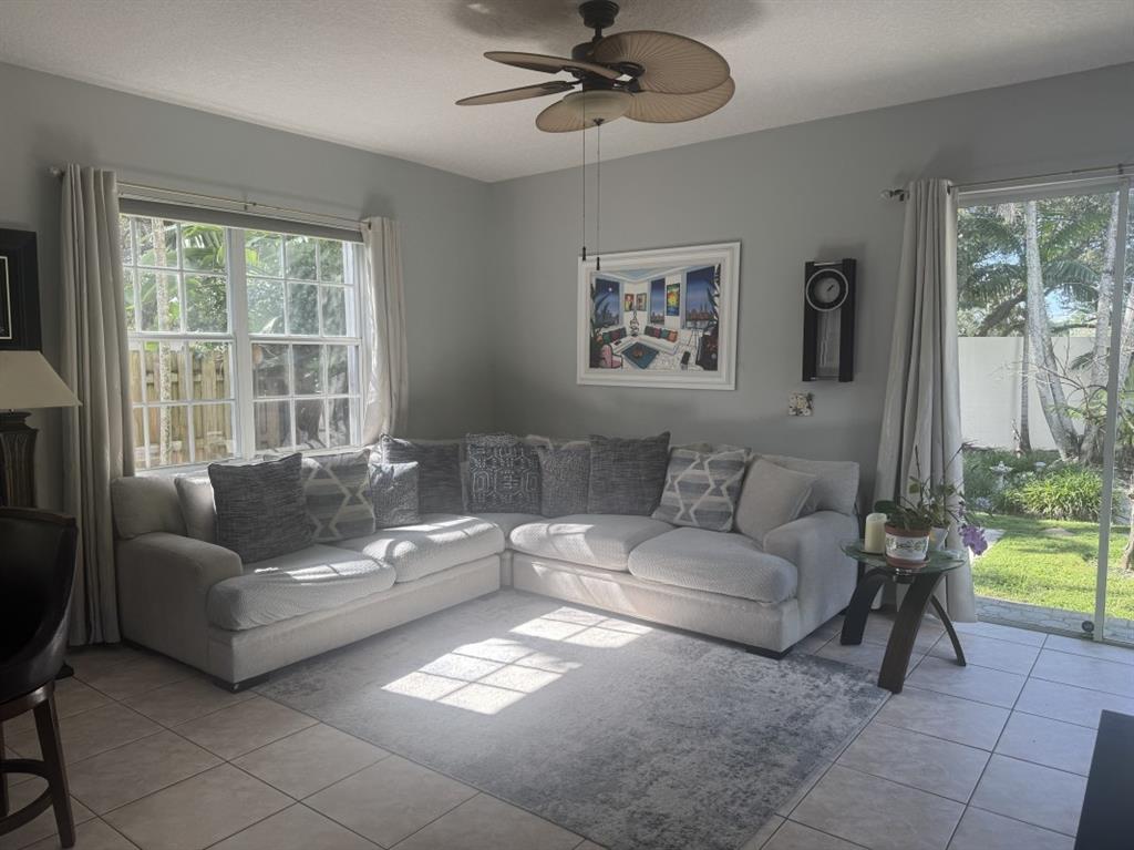 12353 Natalies Cove Road Cooper City, FL 33330 - Photo 6 of 24 a living room with furniture and a large window