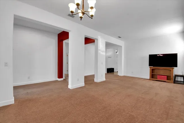 a view of a room with a hallway