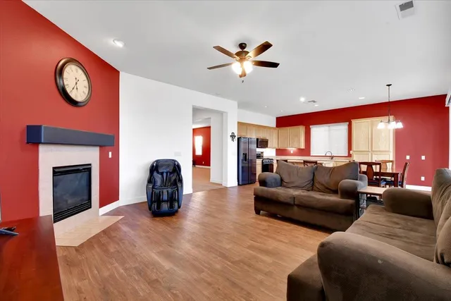 a kitchen with stainless steel appliances granite countertop a stove refrigerator sink and cabinets