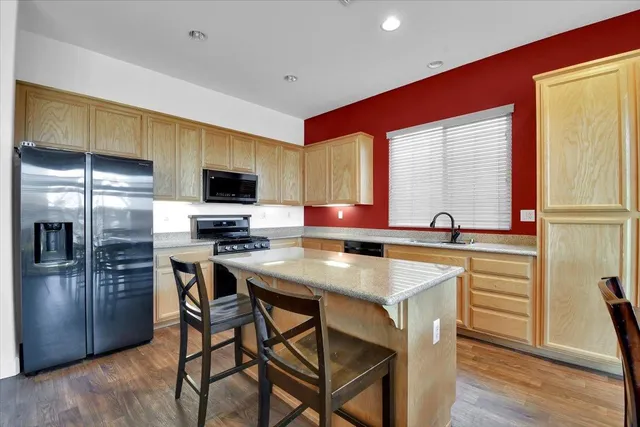 a dining room with furniture window and wooden floor
