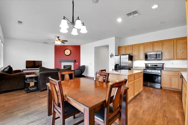 a kitchen with stainless steel appliances granite countertop a sink and cabinets