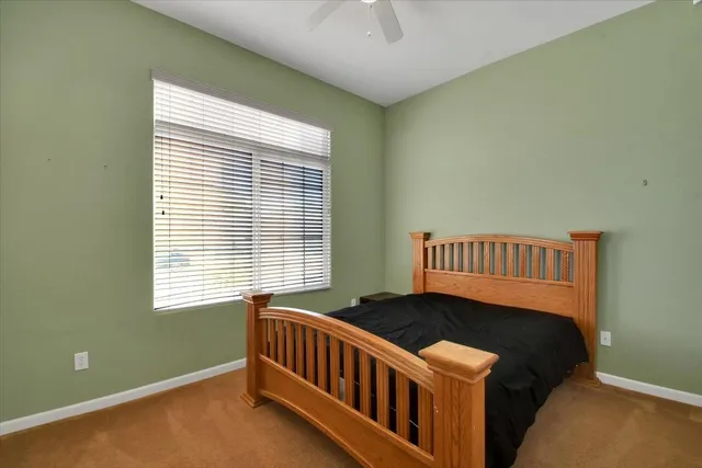a bathroom with a sink mirror and toilet