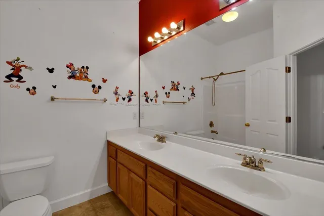 a view of a hallway view with wooden floor and a dining room