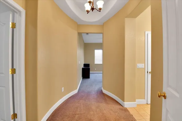 a spacious bedroom with a bed and window