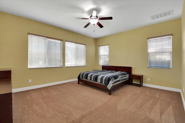 a view of a chairs and table in the patio
