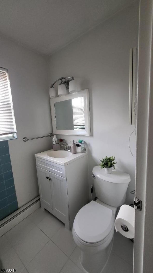 2467 Highway 10, Unit 8B Morris Plains, NJ 07950 - Photo 11 of 15 a bathroom with a toilet sink and mirror